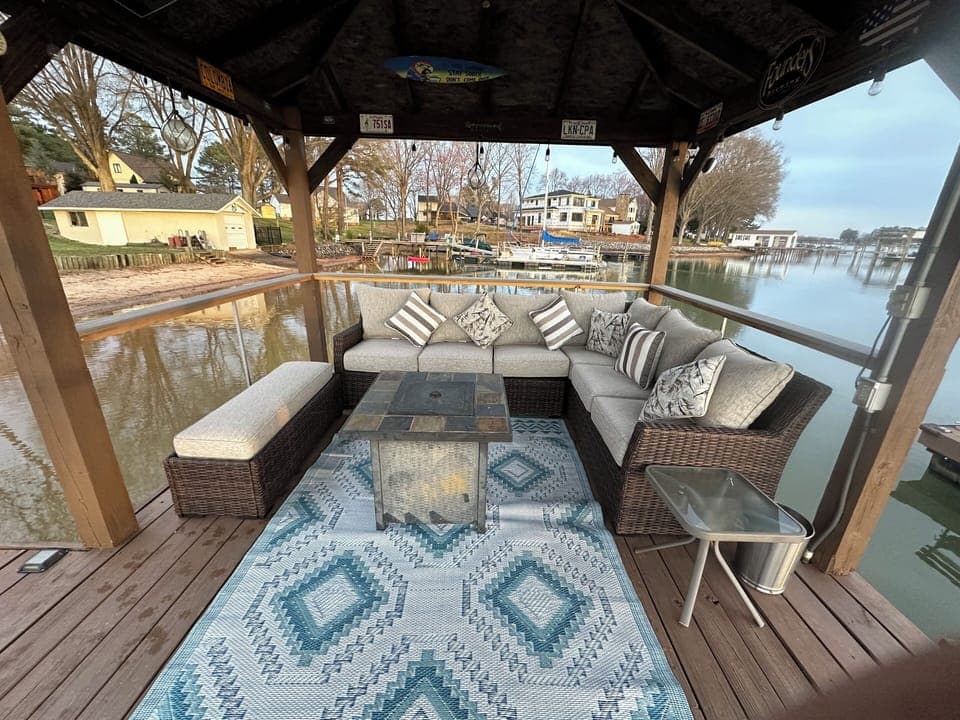 Comfortable Sofa, Bench and Gas Firepit on the gazebo over the lake.