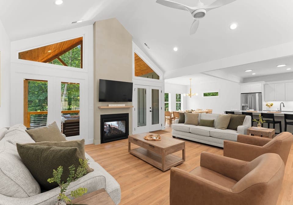 Living room with lake views, fireplace and TV!