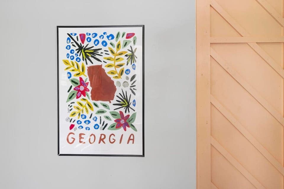 Bring a touch of the Peach State into your stay with this vibrant Georgia poster, adding a pop of color and southern charm to the space.