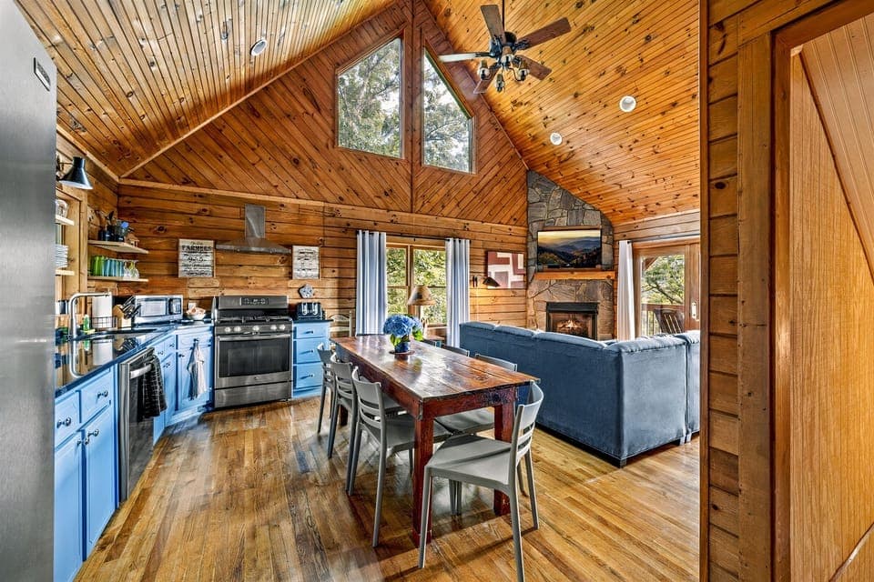 This is the view when you walk in the front door. The kitchen is stocked with all of the cooking supplies that you need to cook meals for your family, just bring food! 