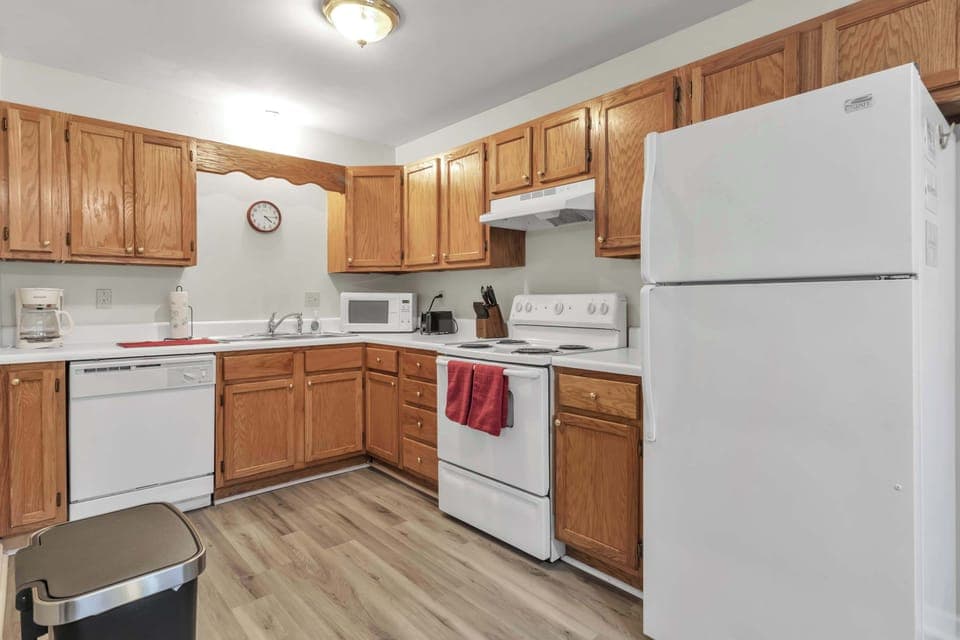 The cozy kitchen offers ample space & all the comforts of home