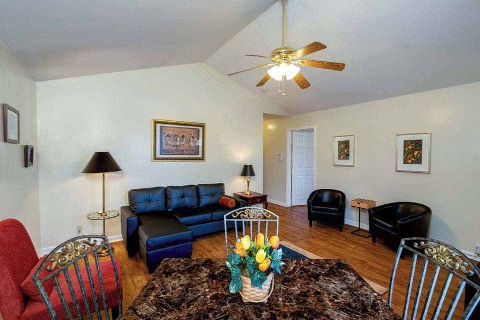Cozy and spacious living area with TV