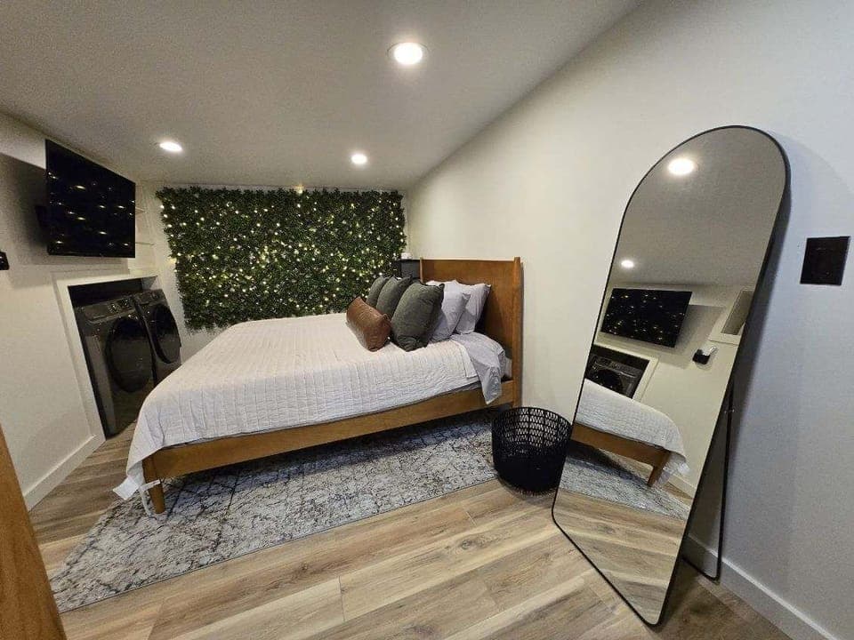 Master Bedroom with King Bed, 42-inch Smart TV, sound machine, blackout curtains and desk with computer monitor.   Full size washer/dryer with detergent provided.
