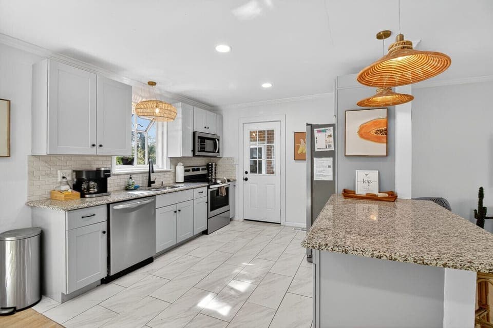 Cook with ease in the fully equipped kitchen, complete with stainless steel appliances, granite counters, and plenty of space to create.