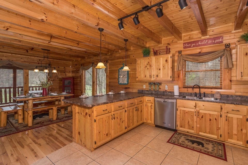Kitchen with stainless appliances and dining space for six