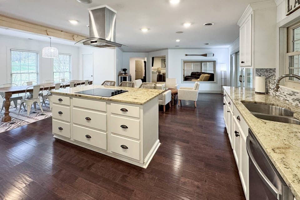 Open concept kitchen, dining and living space - steps away from covered patio with 180 degree view of lake