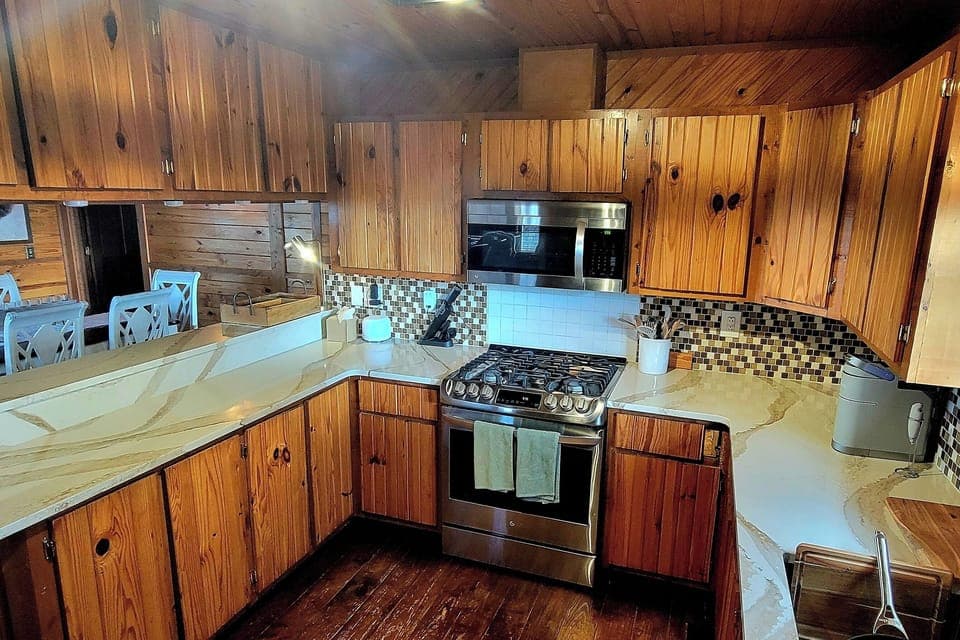 Large kitchen with plenty of counter and cabinet space.  Fully stocked!