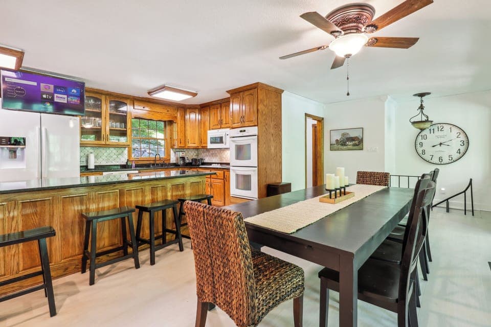 The spacious kitchen has plenty of room to gather together with seating for 14