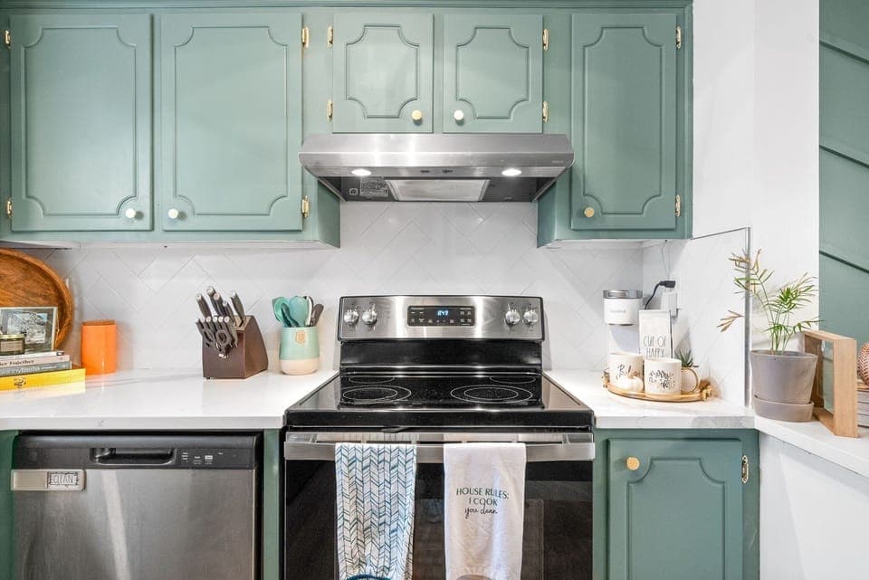 Stainless steel appliances include an oven, stove, & dishwasher