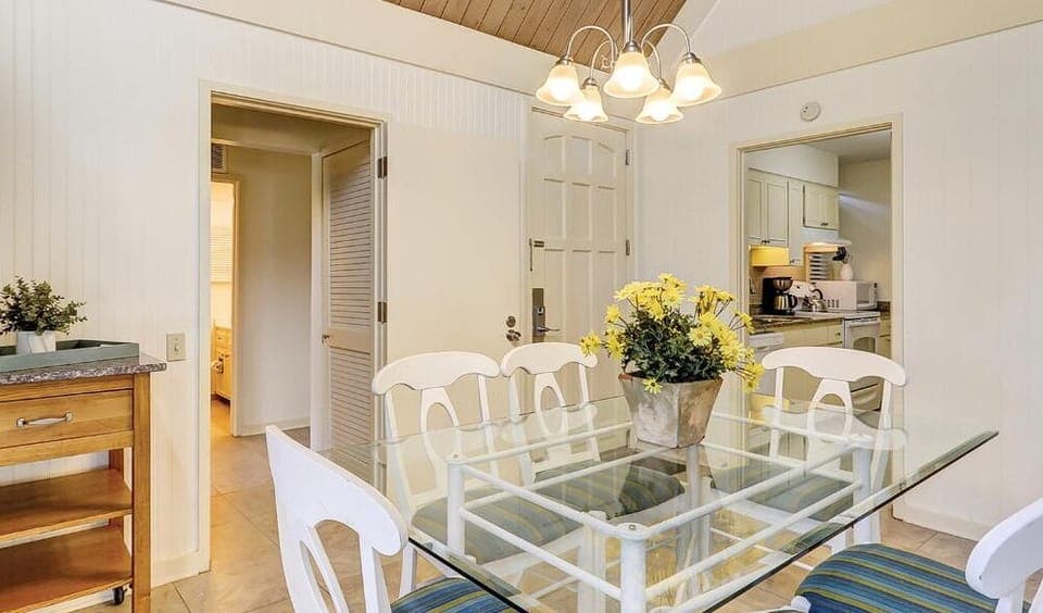 Gather for easy meals under warm lighting and airy ceilings.