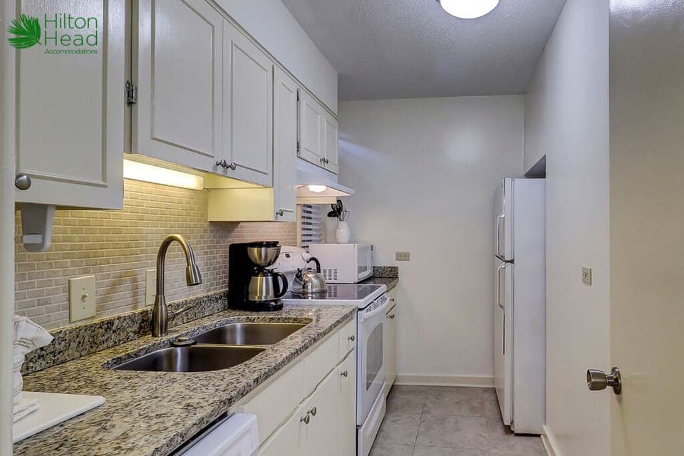 Cook with ease in a bright, fully equipped galley kitchen.