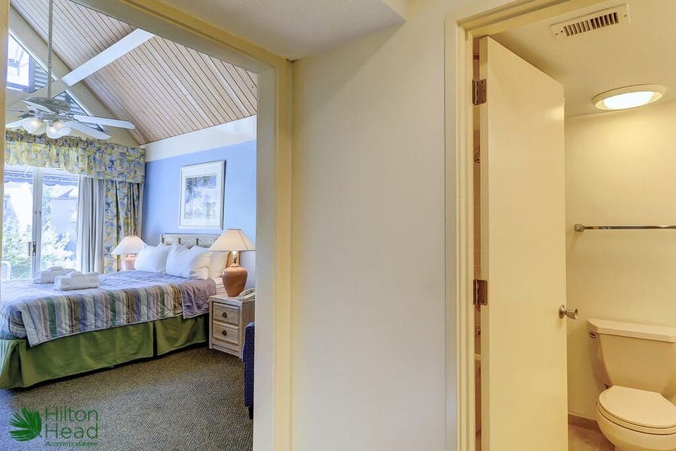 Sink into plush bedding in a bright, airy retreat.