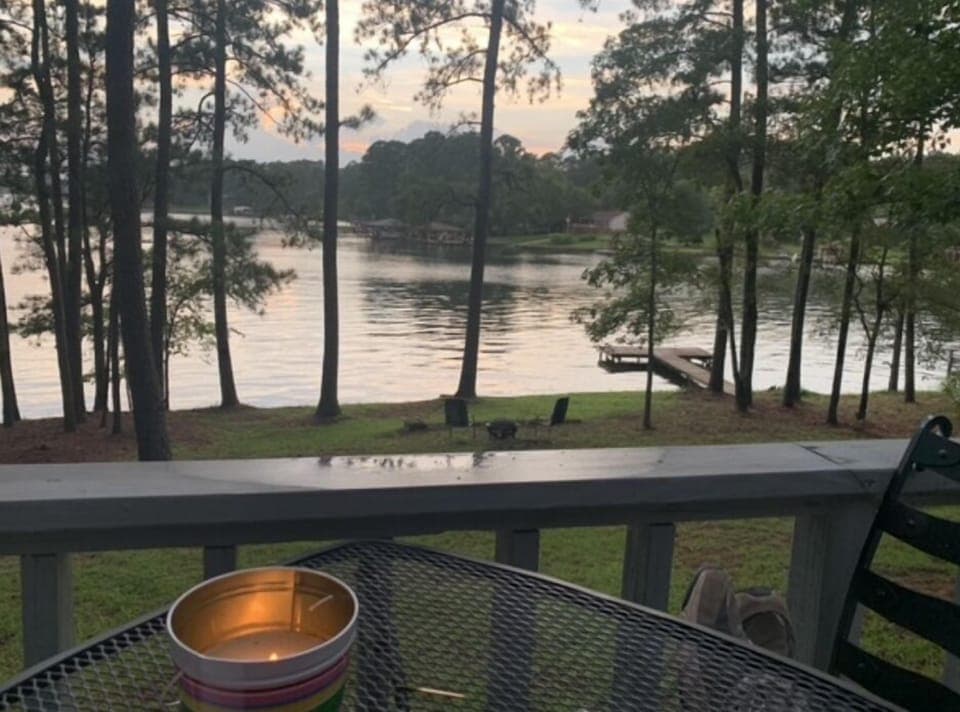 Serene lake view including one of the two private lake docks on property. 