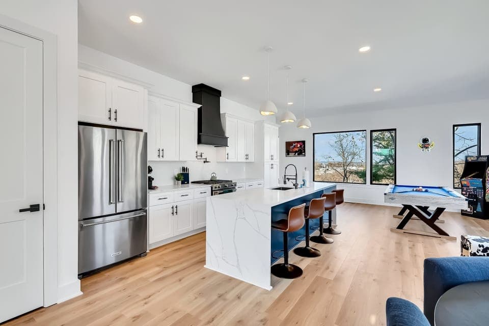 Elevate your Nashville getaway in this stylish vacation rental with an open kitchen, chic game room, and skyline views. Perfect for a bachelorette party or family reunion in Music City!