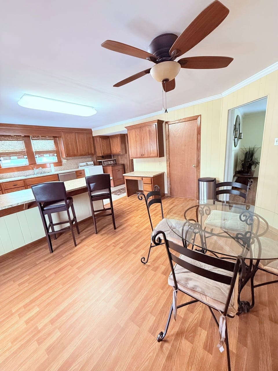 Open Kitchen concept. Bar seating and dining table. 