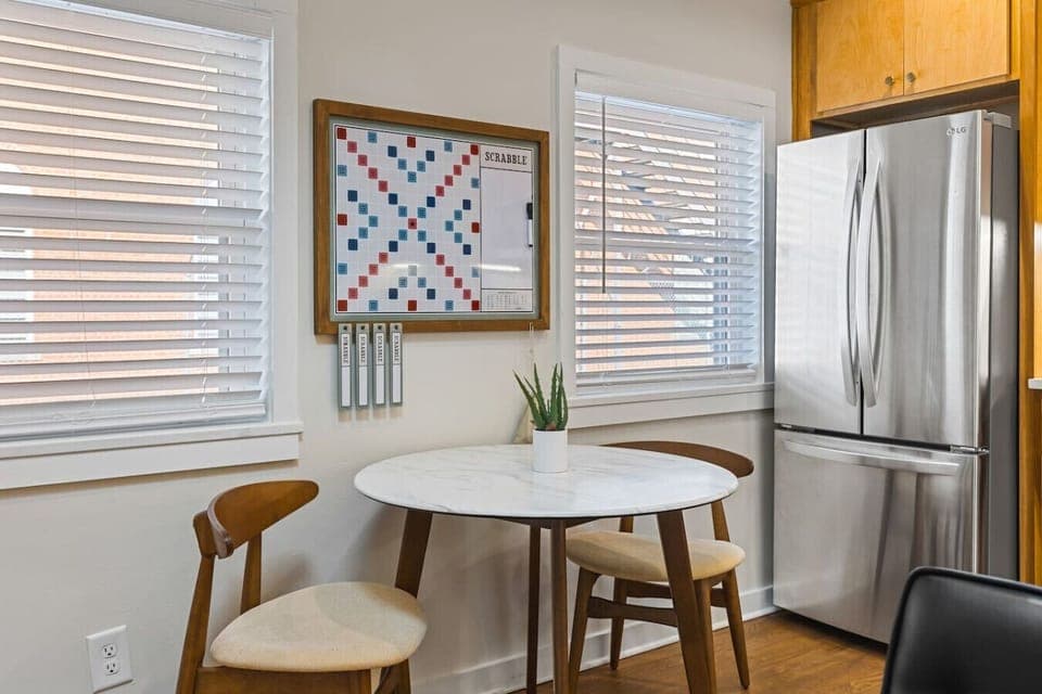 Fully equipped kitchen with all your cooking essentials, drip coffee maker + coffee. Dining table with seating for 2. This room opens up into the living room. Gorgeous mid century modern decor all throughout the condo.