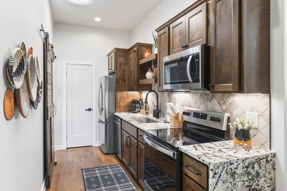 Fully equipped kitchen with all your cooking essentials, drip coffee maker + coffee. Dining table with seating for 6. This room opens up into the living room. Unique colors, wallpaper and decor all throughout the condo.