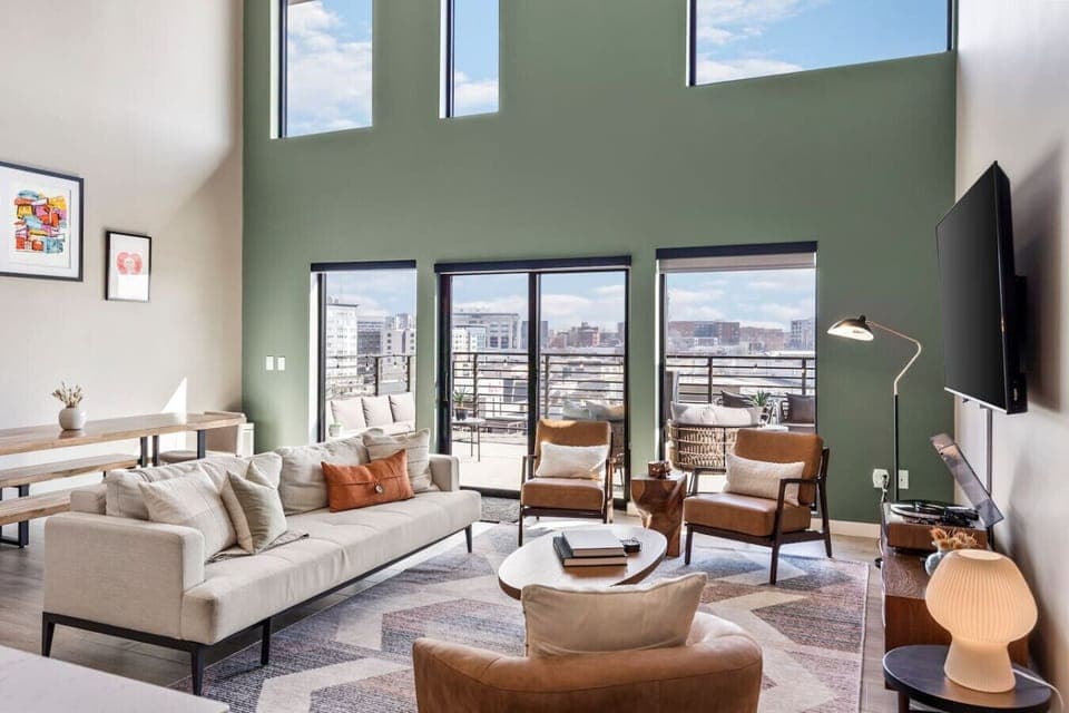 Bright and spacious living room off the kitchen. Smart TV, remote controlled room darkening shades, and pull-out sleeper sofa for ultimate comfort. Dining table that can seat 8 people.