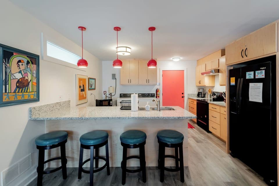 Open and spacious kitchen with bar seating is perfect for enjoying a meal.