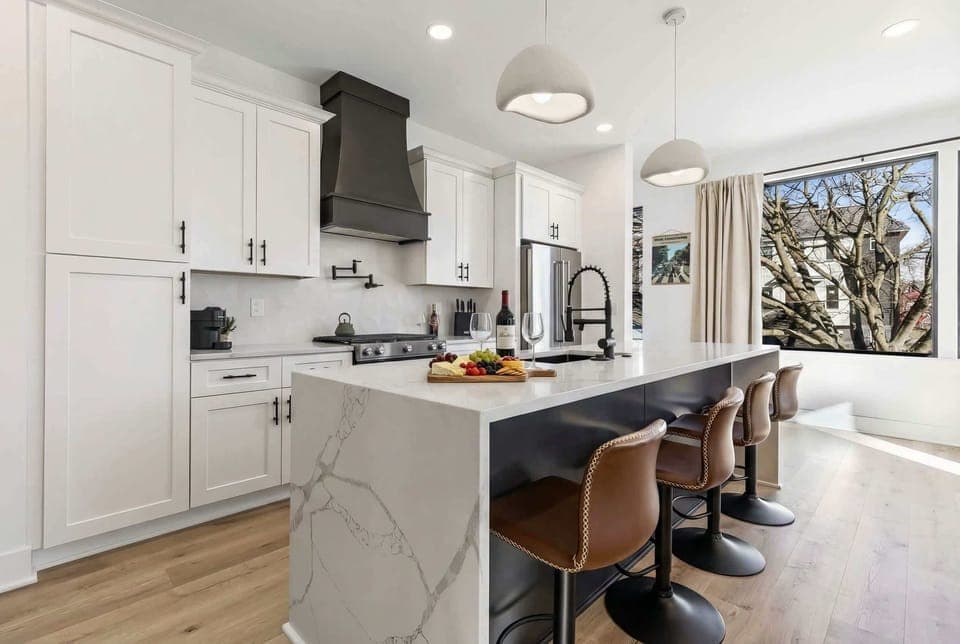 Welcome to this stylish kitchen, perfect for creating memorable moments. With its spacious, chic design and stunning views of Nashville, it's ideal for breakfasts, cocktails, and gatherings. Your luxury vacation rental in Music City awaits!