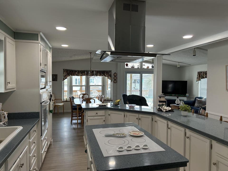 Spacious kitchen with modern island and open dining area