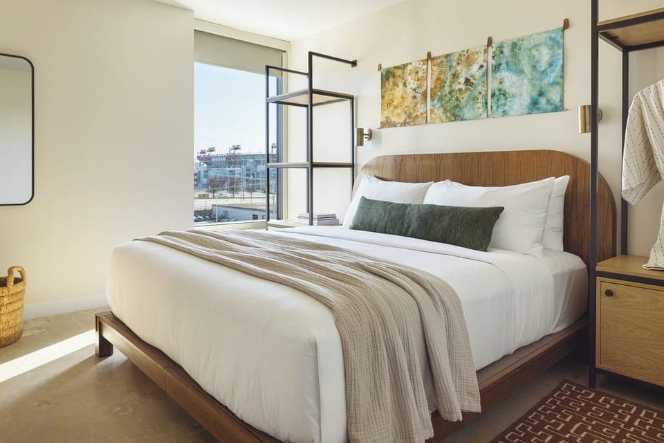 Unwind in sunlit comfort with a plush king bed.
