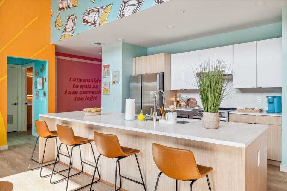 Tequila Sunrise unit: Open concept living room / kitchen / murphy beds
