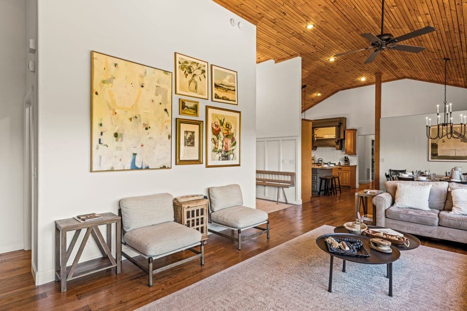 A cozy reading nook with curated artwork and soft seating, perfect for morning coffee or quiet moments.