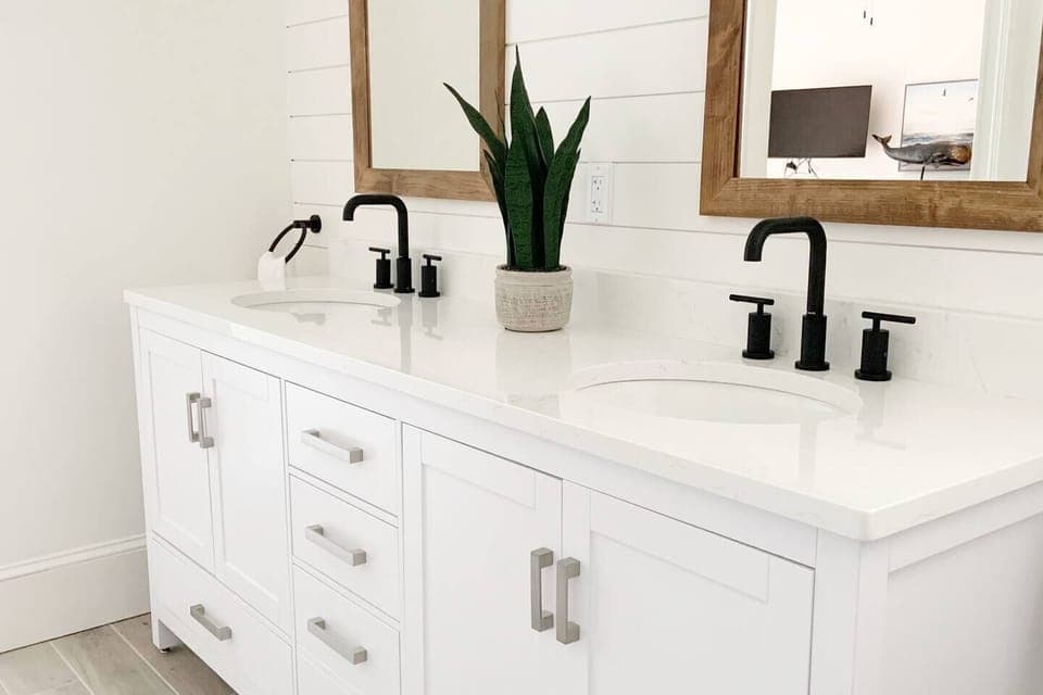 Newly renovated bathroom off master suite with double sinks.
