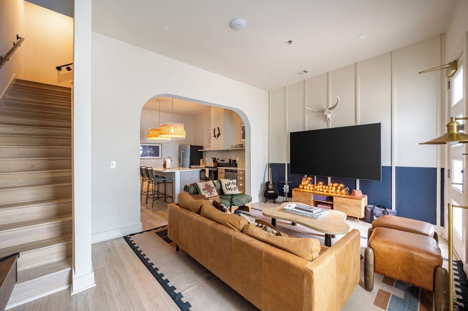 Unit 101: Living room with air hockey table.