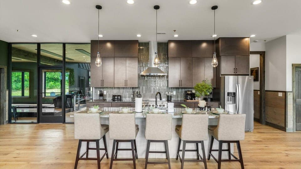 Ample of counter space in the open-concept kitchen, with direct access to the bowling/golf simulator room