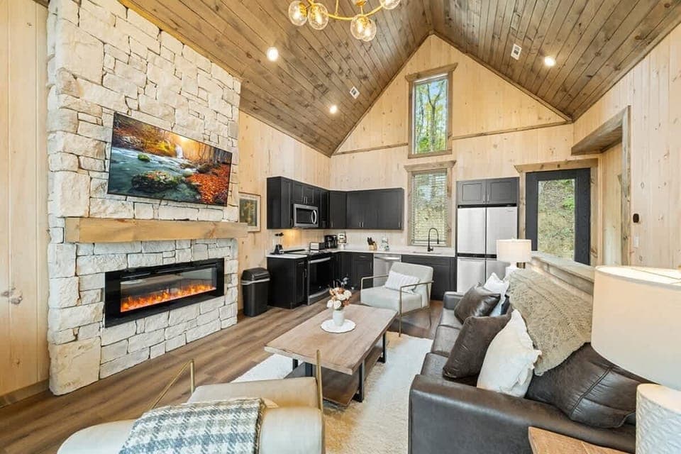Main level living area with a smart TV and an electric fireplace