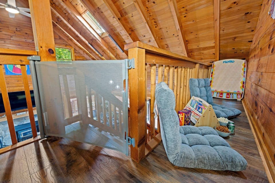 Cozy loft nook with games, snacks, and plush floor seating
