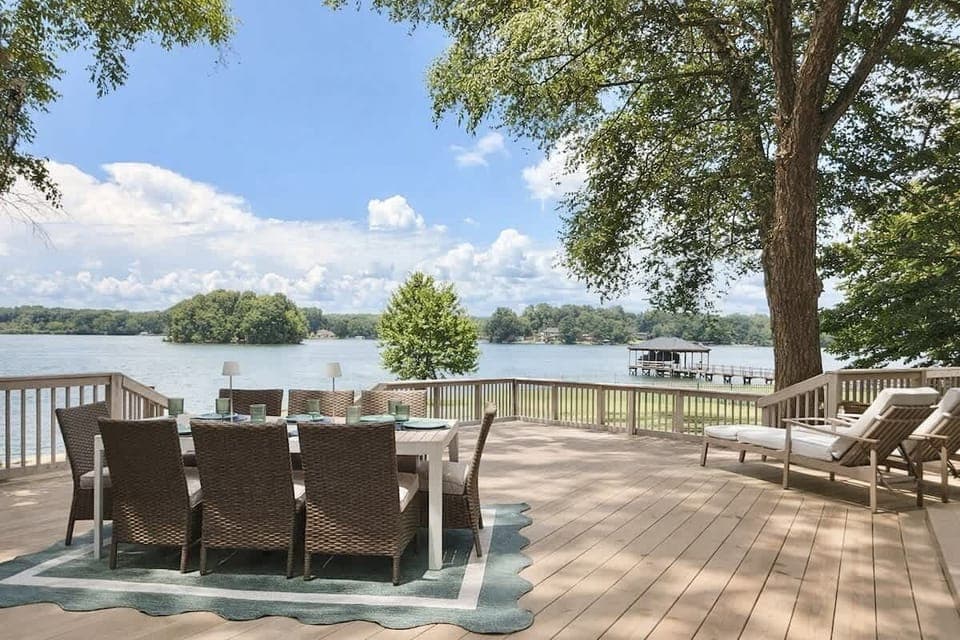 A large deck with dining and comfortable seating to take in the beautiful lake views.