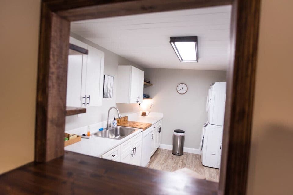 A unit full kitchen with washer and dryer
