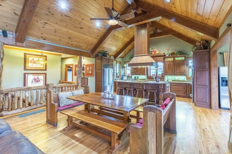 Gather 'round the table! This expansive kitchen and dining area is perfect for creating lasting memories with loved ones. Rustic charm meets modern convenience.