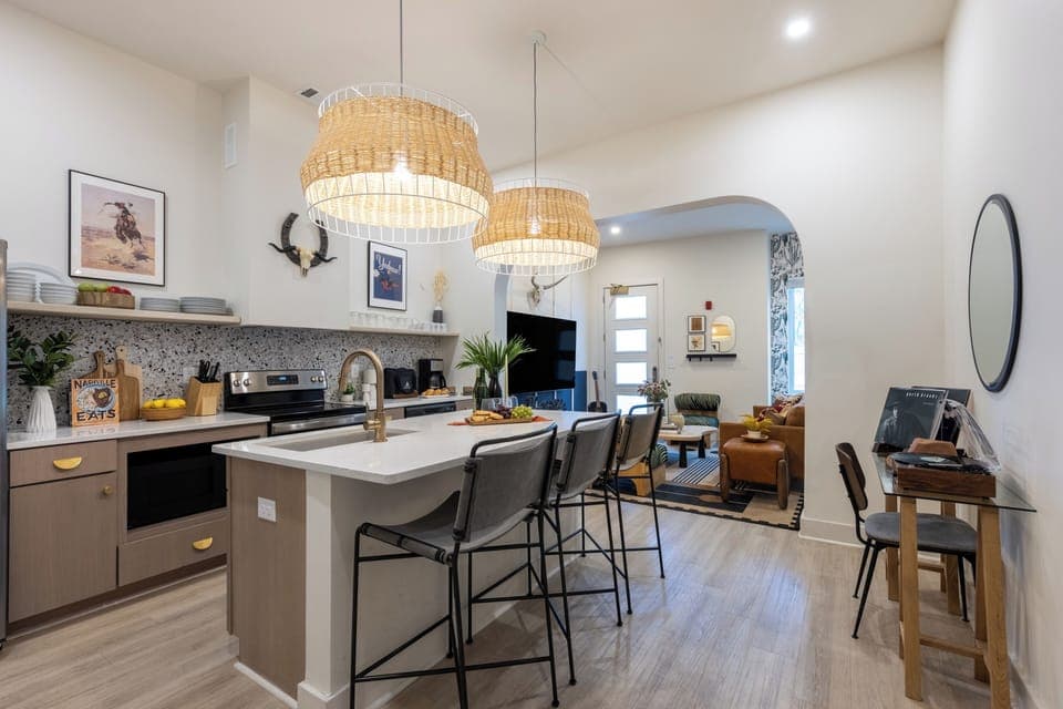 Fully equipped kitchen with an island counter and barstool seating. (Outrider 101)