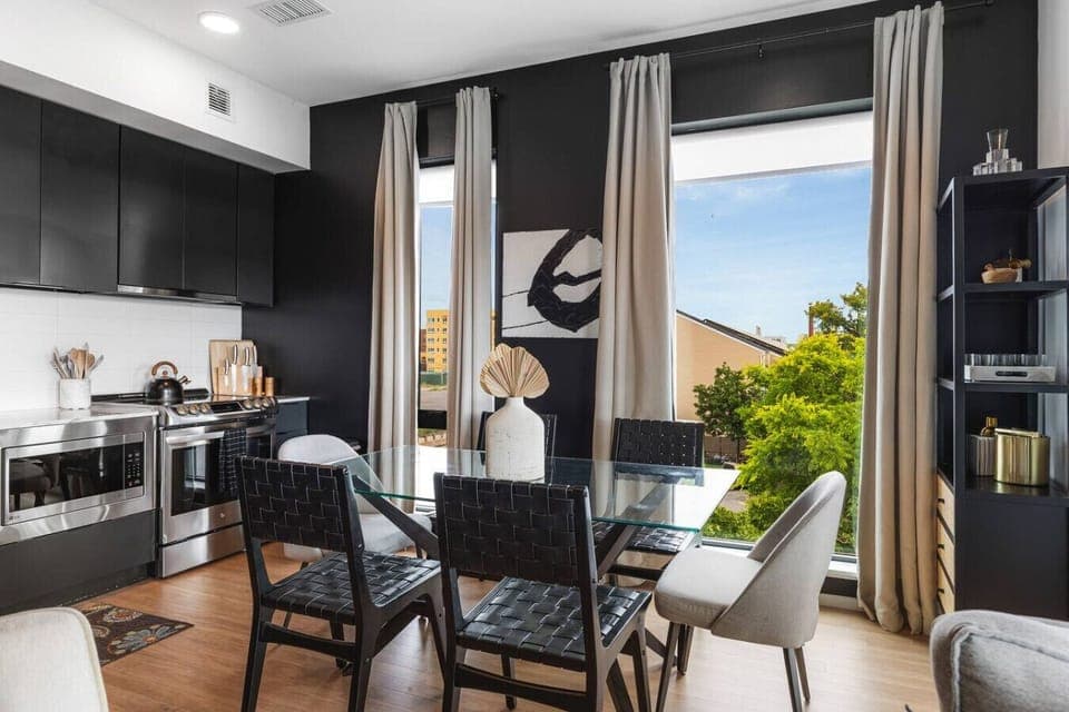 Our kitchen is fully equipped with high-end appliances and two dining areas. Private balcony off of this area to enjoy your morning coffee.