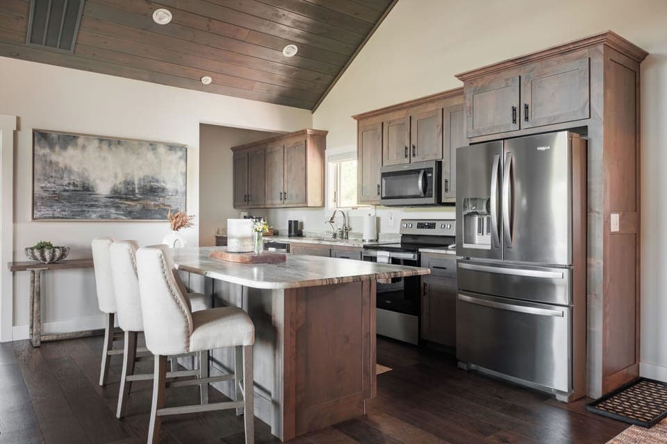 Fully equipped kitchen with stainless appliances and spacious island seating. Great for cooking and entertaining.