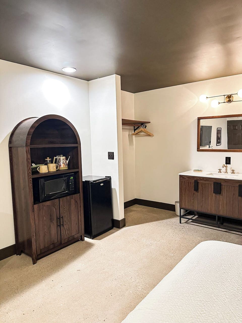 Microwave, mini fridge, closet, tea + coffee station