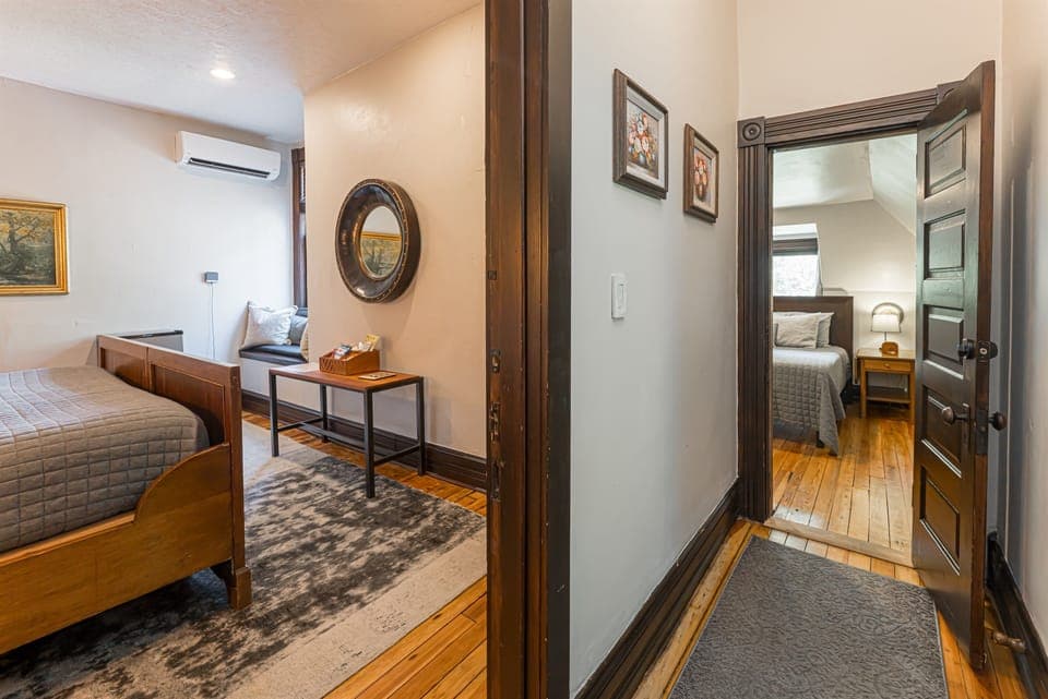 View of bedroom 5 and 6 via their shared private hallway (the two rooms share a bathroom via this private hallway)