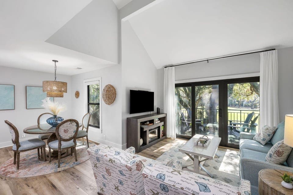 Enjoy an open-concept living and dining area with high ceilings and plenty of natural light. Large sliding glass doors lead directly to your private balcony.