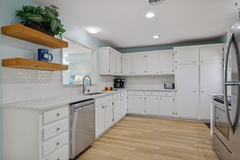 Fully Equipped Comfort including stocked kitchen, Smart TVs, washer/dryer, and cozy furnishings.