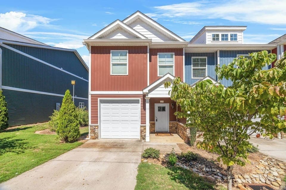 Welcome to your Spartanburg stay, featuring a modern facade with a private driveway and garage.