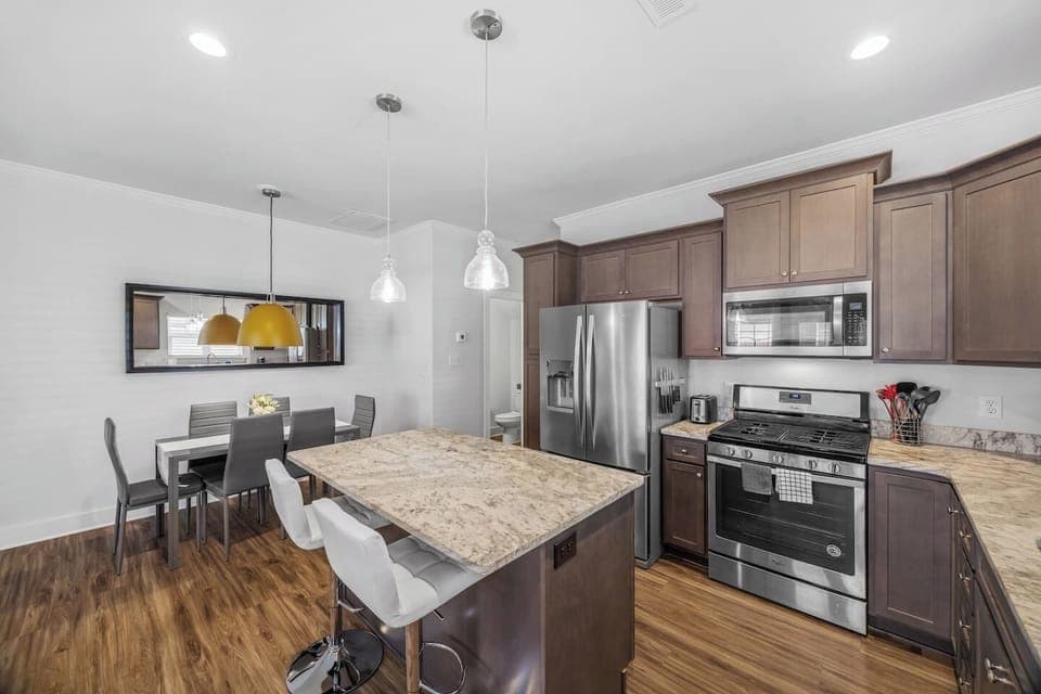 Open layout keeps the kitchen seamlessly connected to the dining and living spaces for easy entertaining.