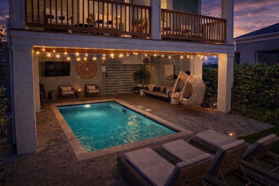 Inviting backyard with a sparkling pool and lounge chairs for relaxing in the sun.