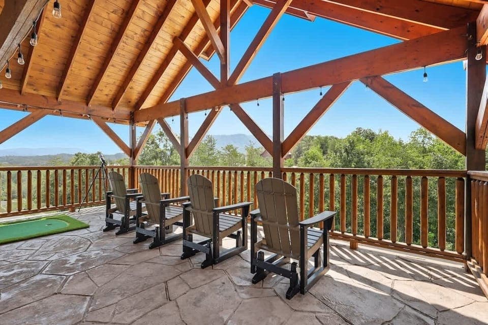 Enjoy the mountain views from the top of the raised Terrace! The Terrace also has The Terrace above the pool house has minigolf, lounge seating, swinging chairs, additional dining seating and an outdoor theater!