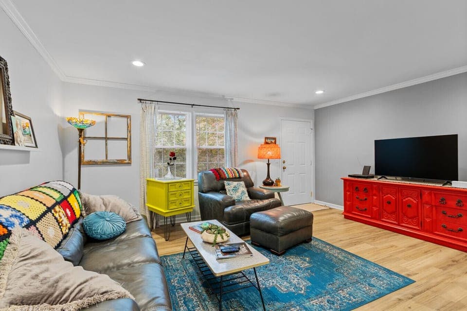 Step into color and comfort. Sink into plush seating, stream your favorites on the Smart TV, and soak in the colorful charm of a space designed for relaxing, gathering, and feeling right at home.