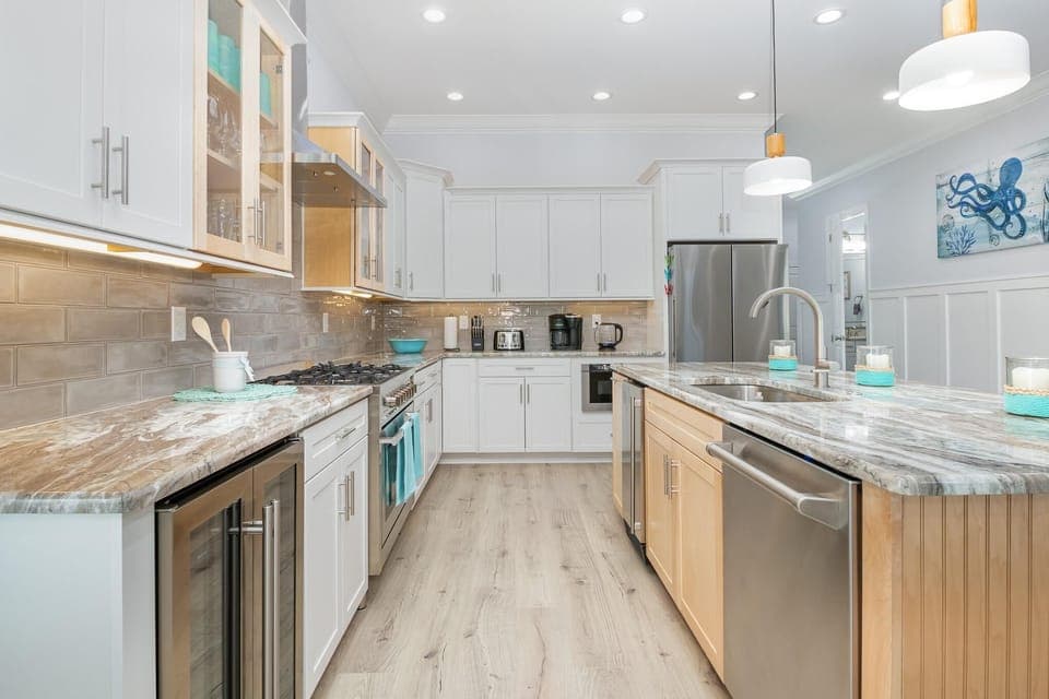 Spacious modern kitchen with sleek appliances and bright lighting