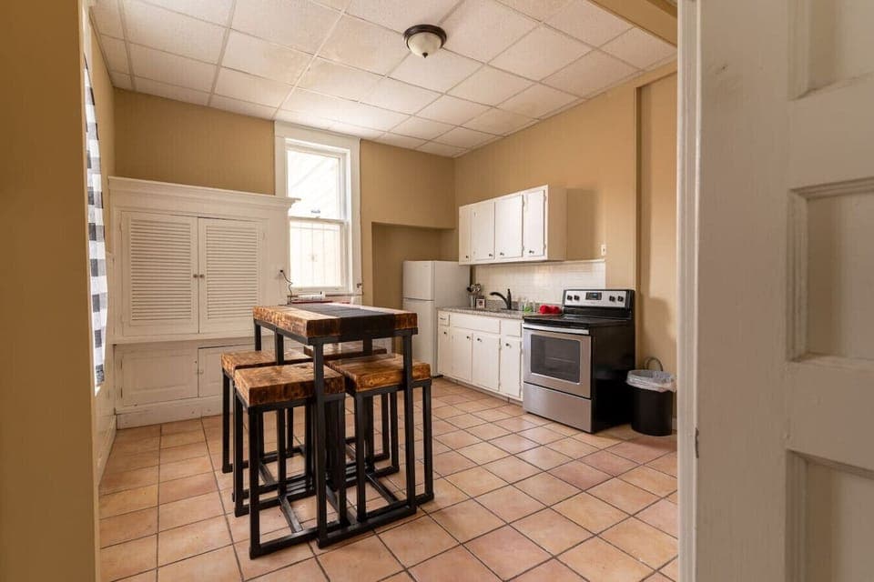 Cook meals together or share stories around the rustic dining island.